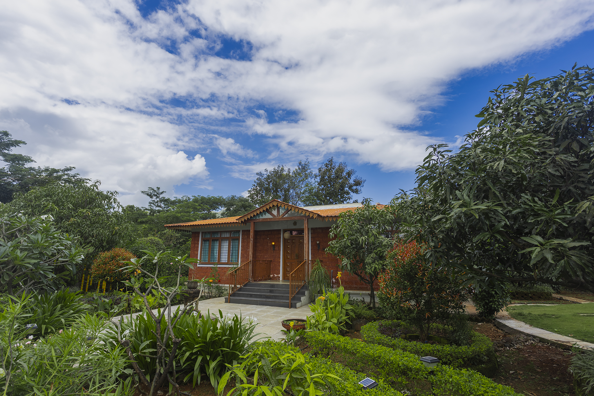 Garden with Flower Beds and Mango Trees